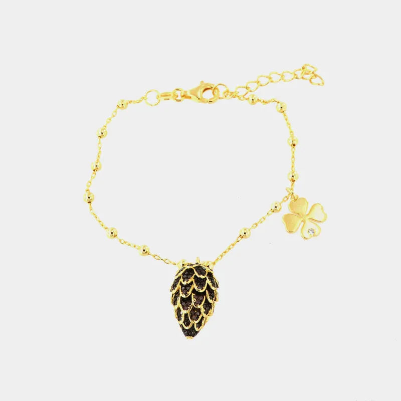 Bracciale in Argento 925 con ciondolo pigna e zirconi scuri, quadrifoglio con punto luce — collezione PIGNA